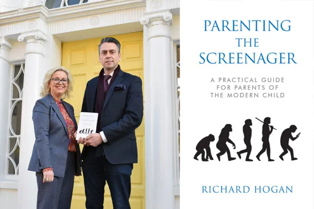 Richard Hogan posing with book next to Yvonne O Toole