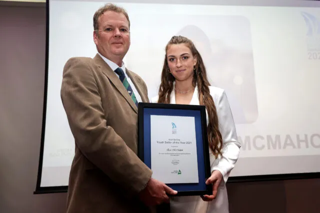 Eve pictured with Harry Hermon, Chief Executive, Irish Sailing receiving award