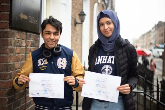 sha Muzammel and Udaiveer Parihar showing their certificates