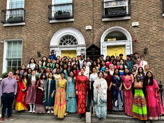 A large group of people outside the IOE entrance