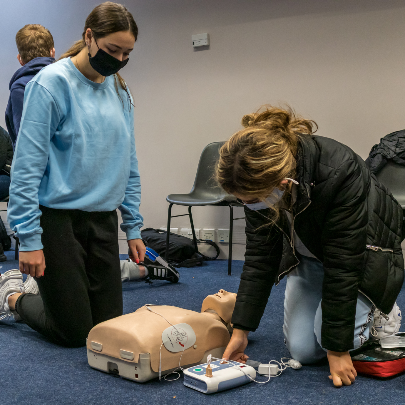 Students Practicing CPR together