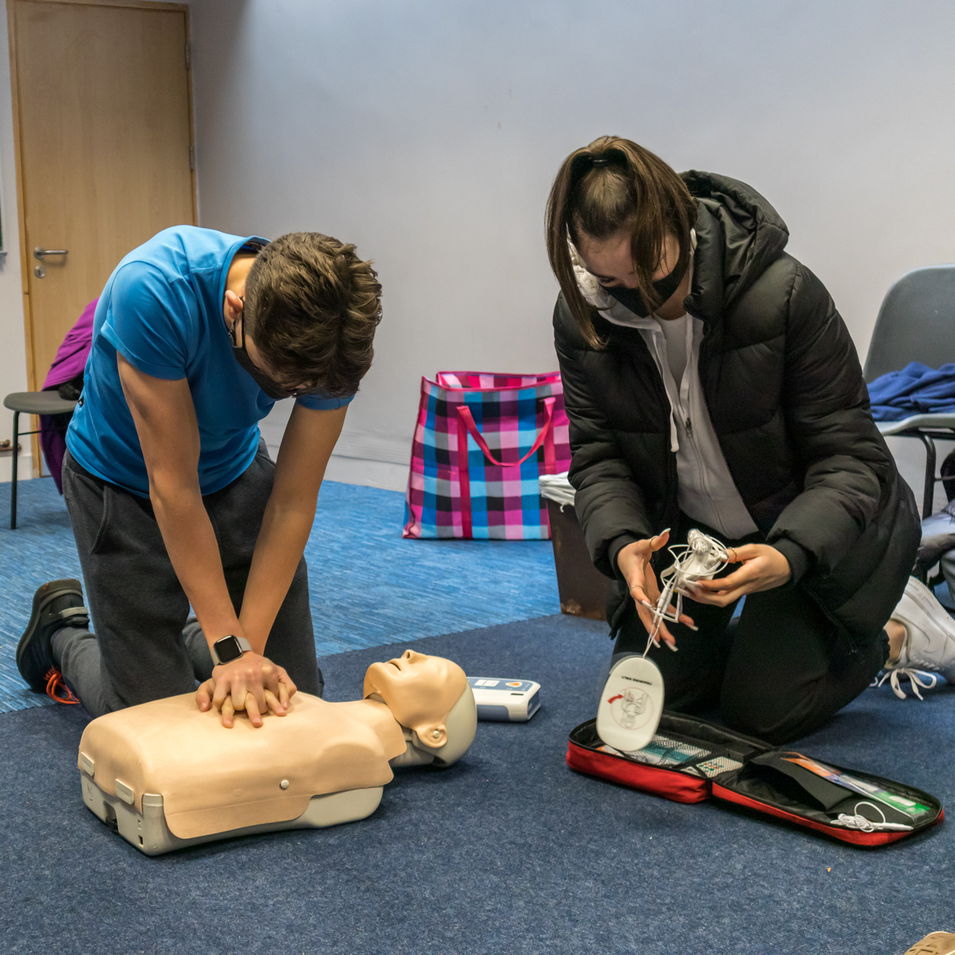Students practicing CPR together