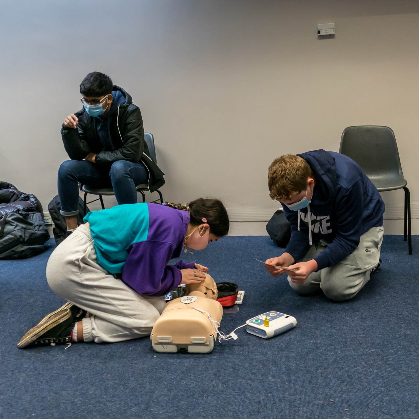 Students Practicing CPR together