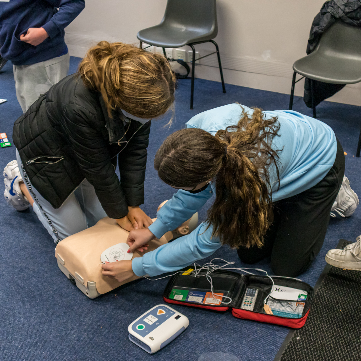 Students Practicing CPR together