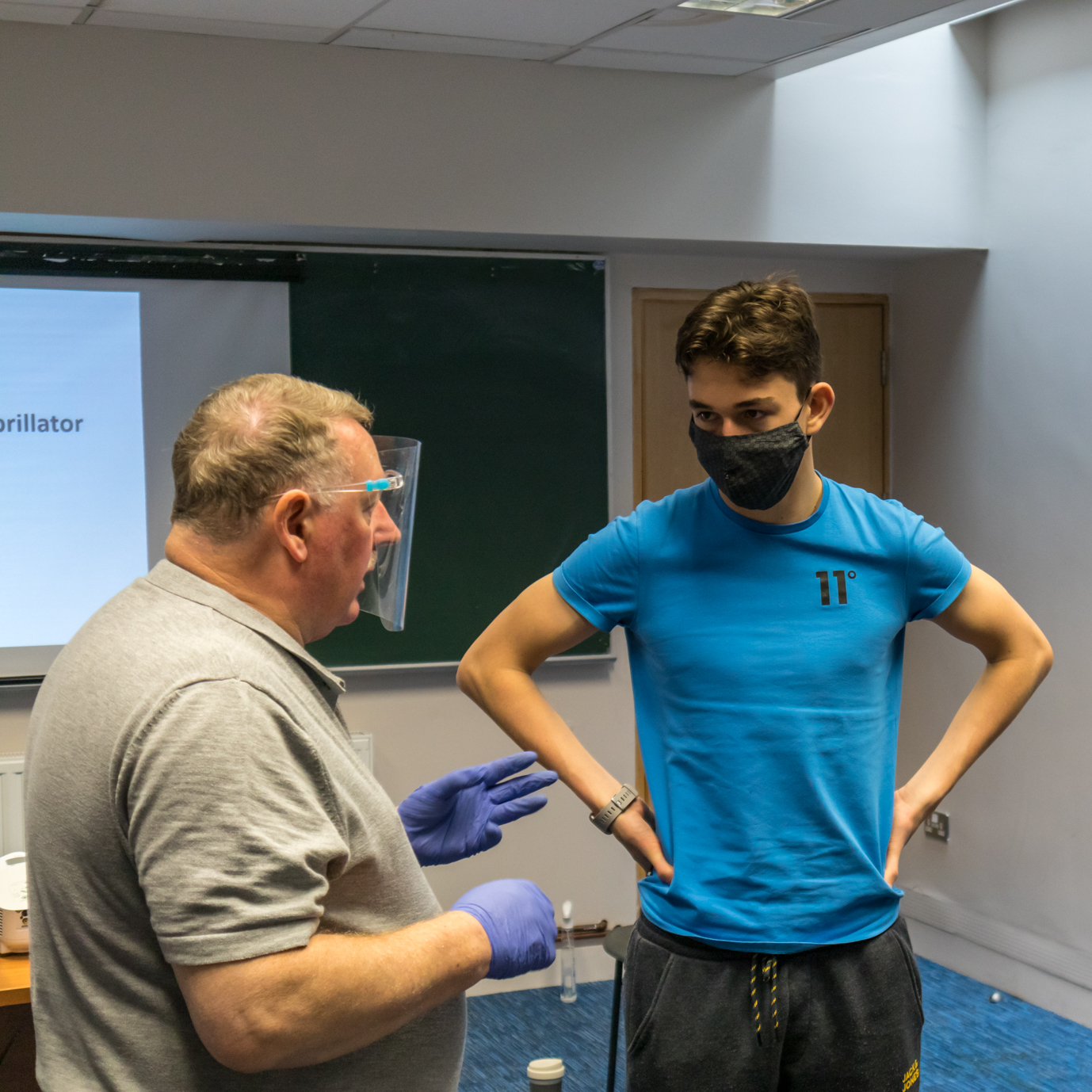 Instructor talking to student