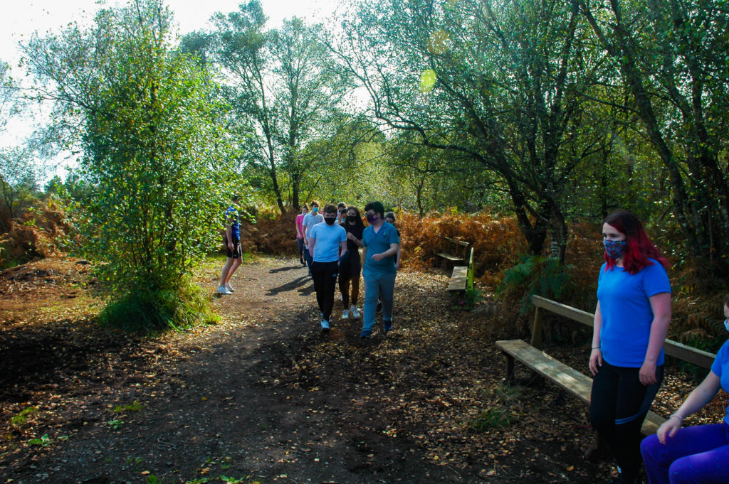 Students outside walking nature trail