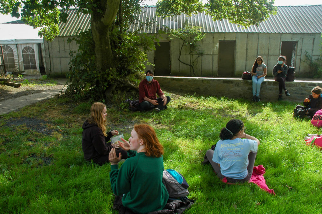 Students sitting on grass