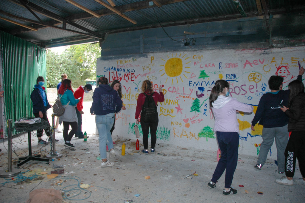 Students drawing on wall