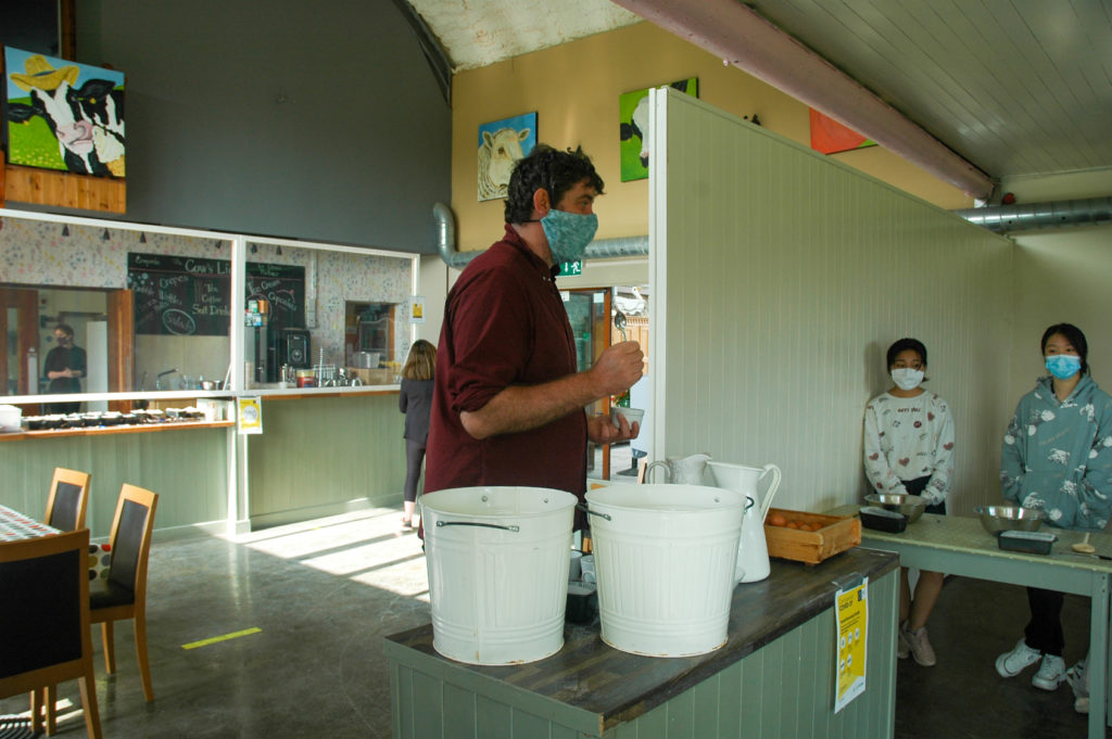 Teacher instructing students on baking