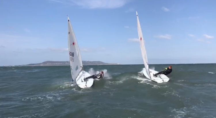 Eve McMahon Sailing next to another sailor