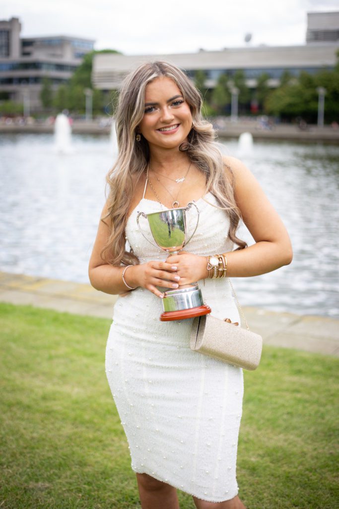 Woman posing with her trophy