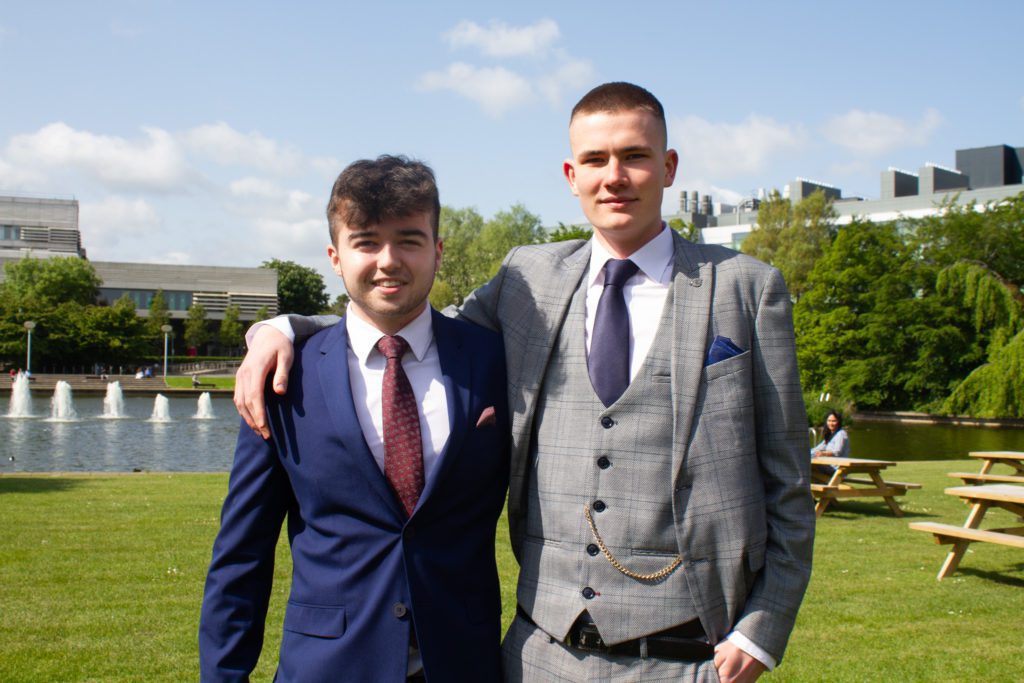 2 men posing for photo