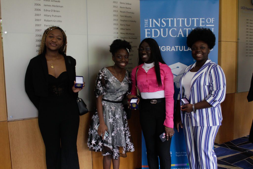 4 women posing for graduation photo