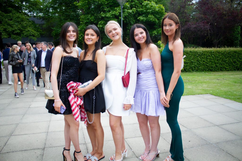 5 students posing for graduation photo