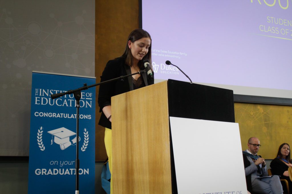 Woman giving speech at podium