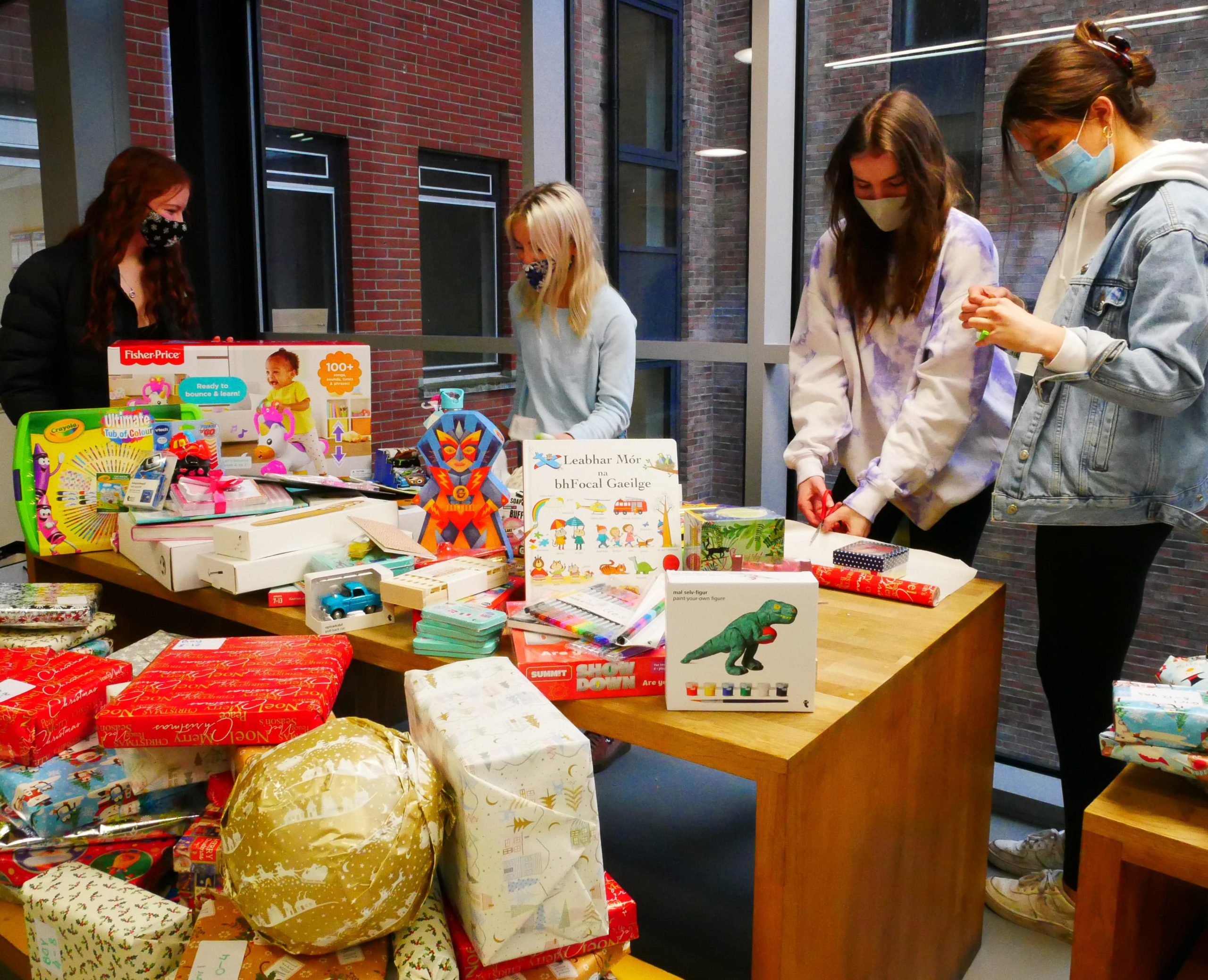 Students wrapping the Christmas Gifts