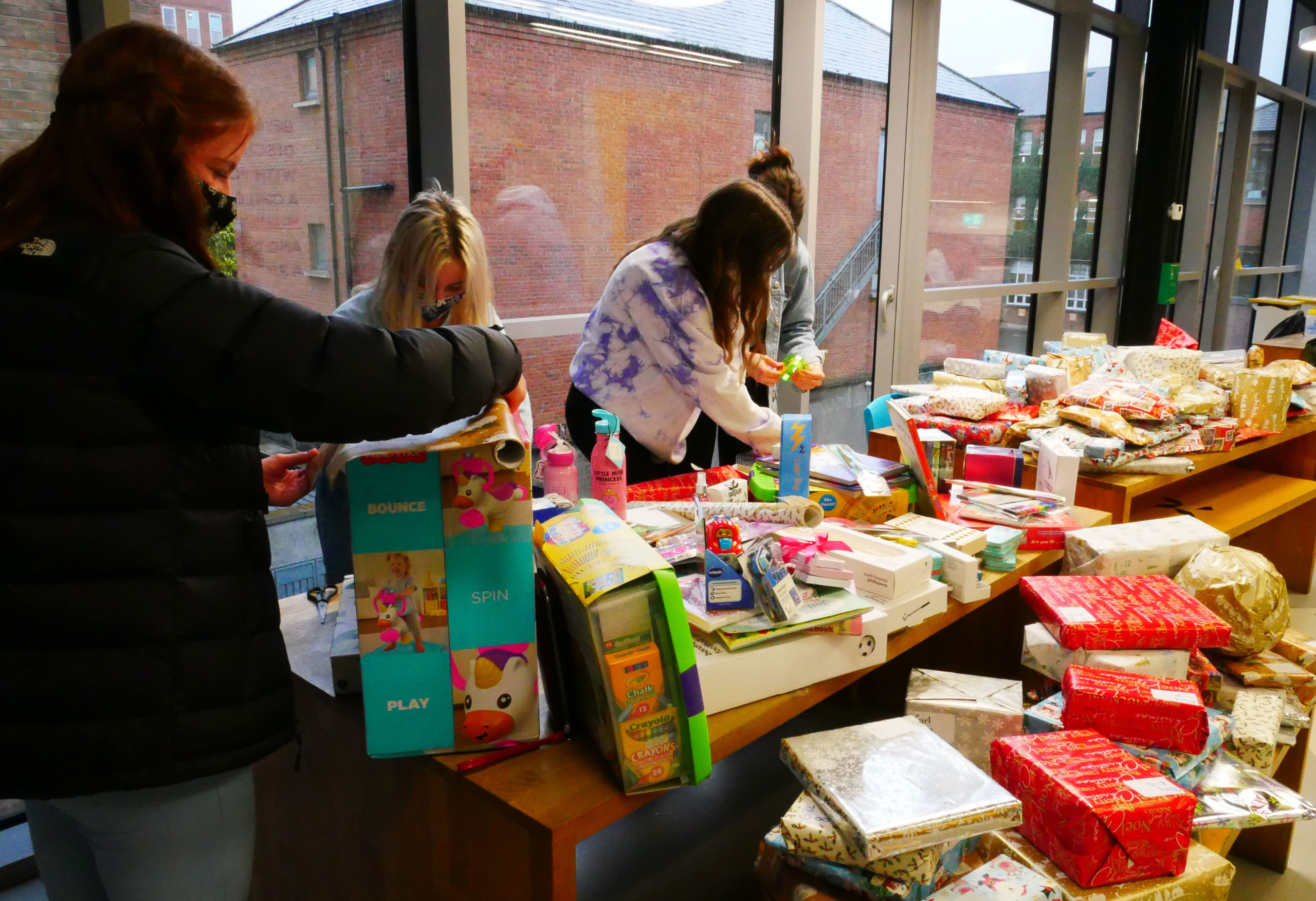Students wrapping the Christmas Gifts