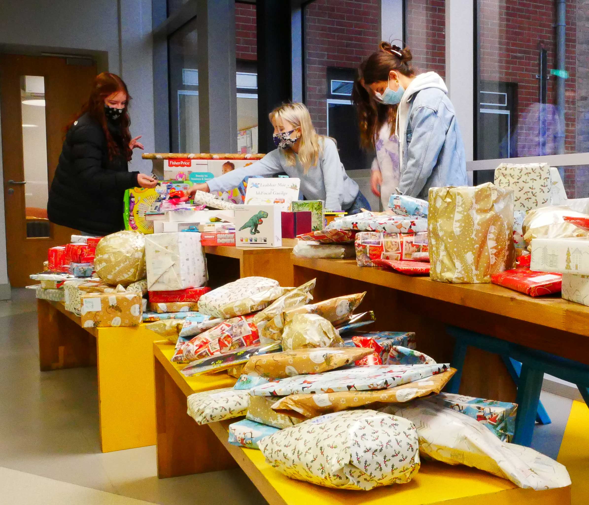 Students wrapping Christmas Gifts