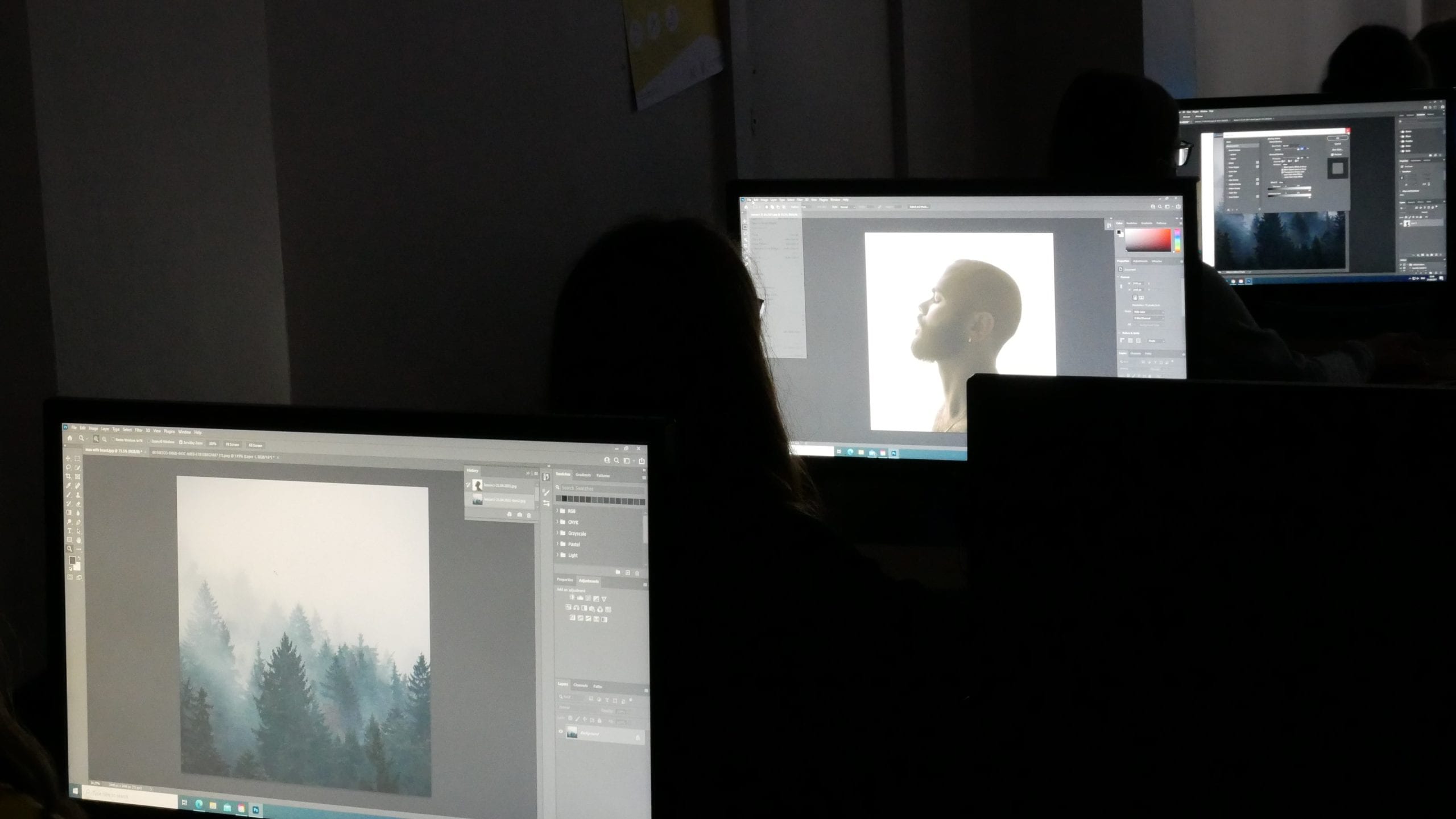 Students replicating what the graphic designer is showcasing them on a whiteboard