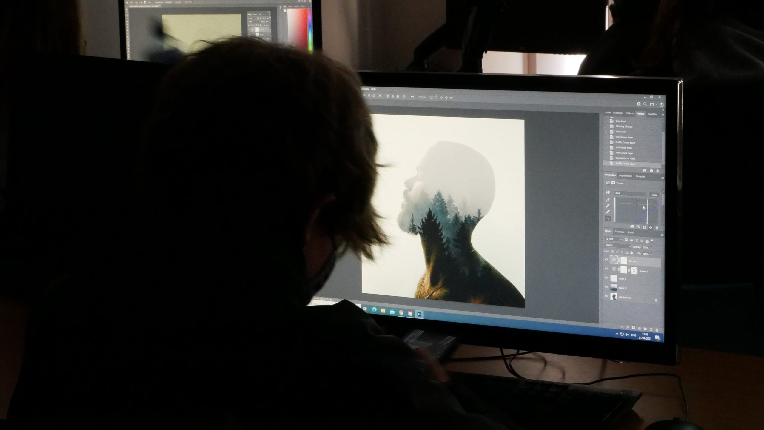 Students replicating what the graphic designer is showcasing them on a whiteboard