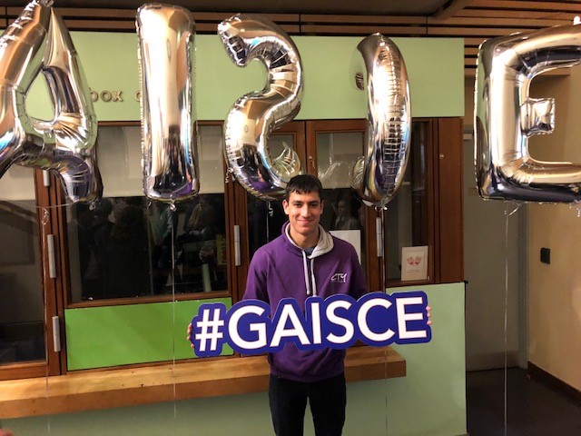 Adam Killea holding a hashtag GAISCE sign