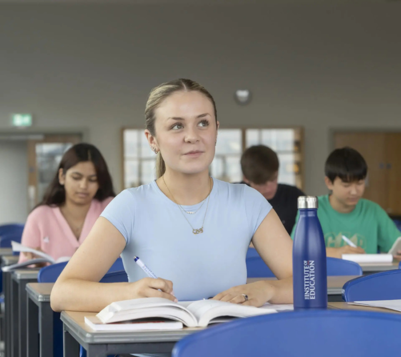 Student taking notes in class