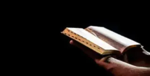 a-man-holds-an-open-bible-the-concept-of-a-relati-2023-11-27-05-09-42-utc-300×153