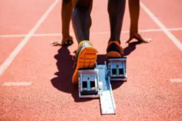 feet-of-an-athlete-on-a-starting-block-about-to-ru-2023-11-27-05-36-11-utc-1-300×200