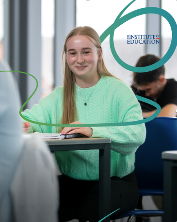 A smiling student sits at a desk with a notebook, with The Institute of Education logo overlaid in the corner.